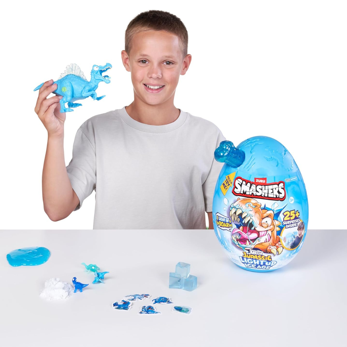 Smashers Mega Jurassic Light Up Ice Age Spinosaurus Dino Egg Toy with 25 Surprises Slime Sand Glow Features Roaring Sound Effects Collectible Dinosaur Build Kit for Kids 3+
