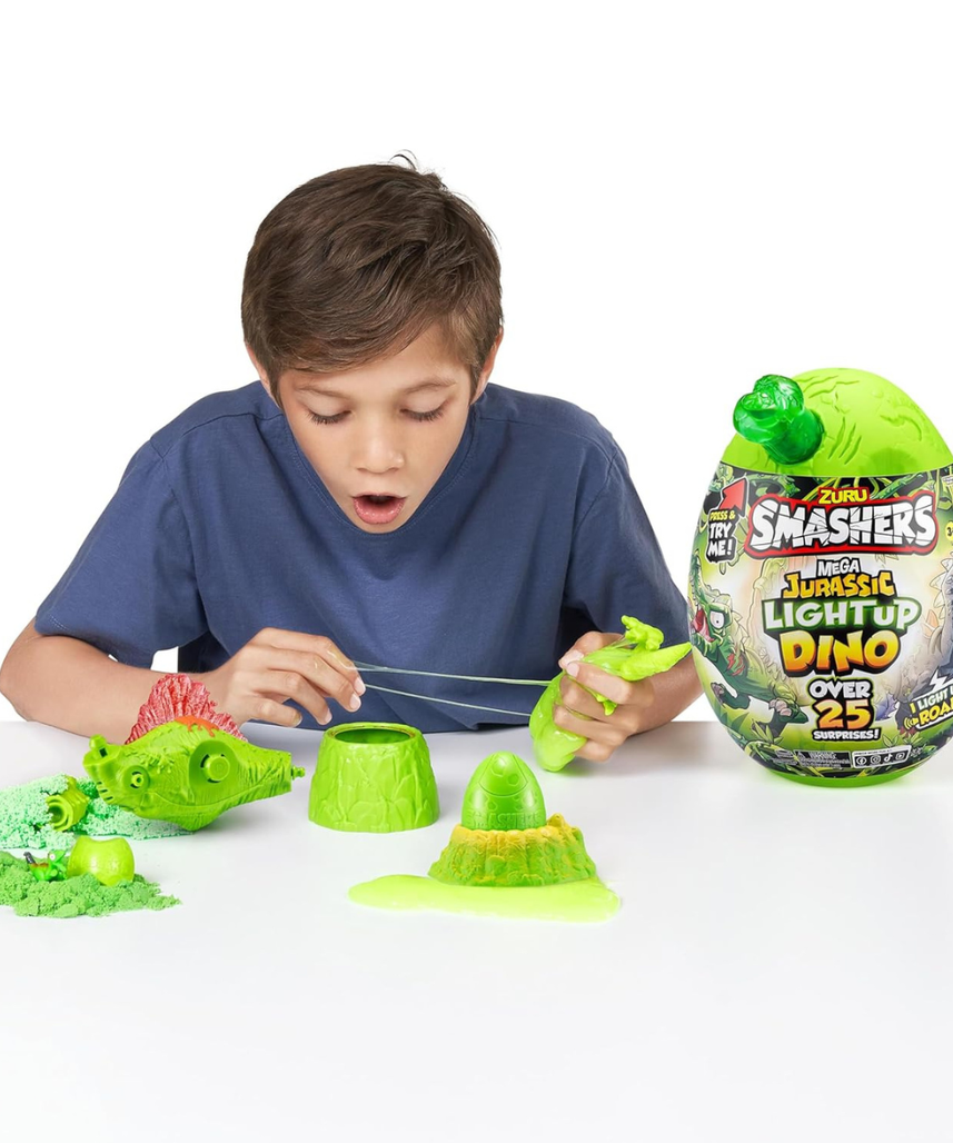 Zuru Smashers Mega Dino Combo Pack Dino Island and Jurassic Light Up Dino Egg with 25+ Surprises Slime Sand Foam Mini Eggs Buildable Dinosaurs Light Up and Roaring Features Collectible Toy Playset for Kids 5+