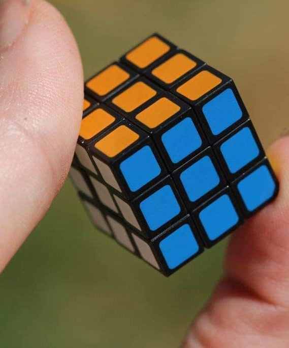Worlds Smallest Cubo de Rubik edición miniatura, tamaño de bolsillo, puzzle 3D