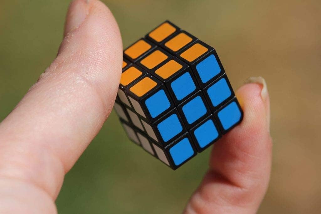 Worlds Smallest Cubo de Rubik edición miniatura, tamaño de bolsillo, puzzle 3D