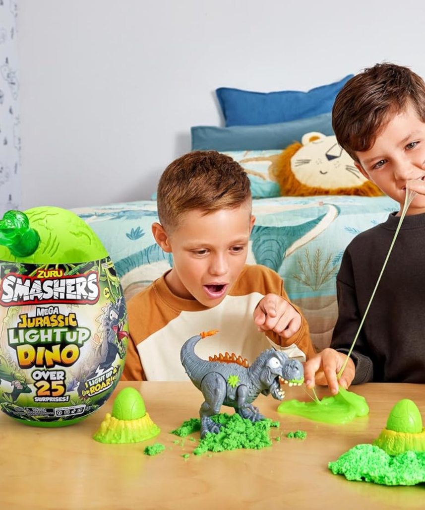 Zuru Smashers Mega Dino Combo Pack Dino Island and Jurassic Light Up Dino Egg with 25+ Surprises Slime Sand Foam Mini Eggs Buildable Dinosaurs Light Up and Roaring Features Collectible Toy Playset for Kids 5+