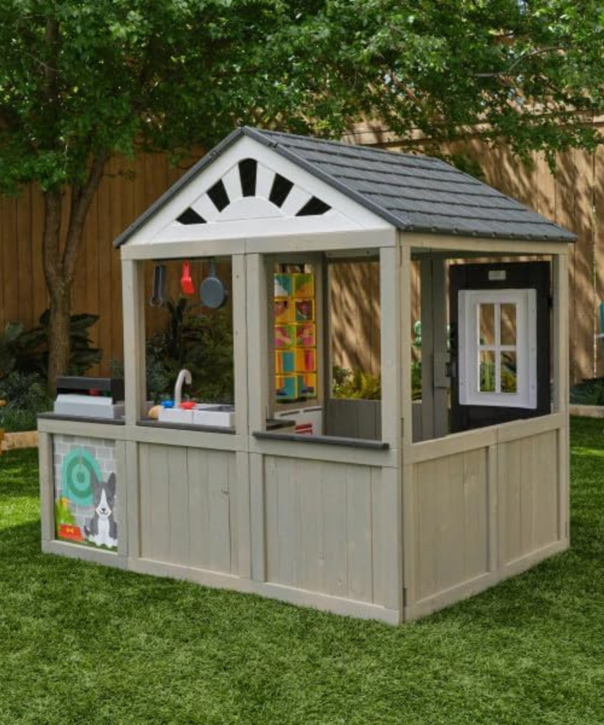 KidKraft Patio Party Wooden Outdoor Playhouse with Spinner Block Puzzle, 14pc, Backyard Playhouse for Kids Ages 3 and Up, Role Play Grill, Sink and Interactive Accessories