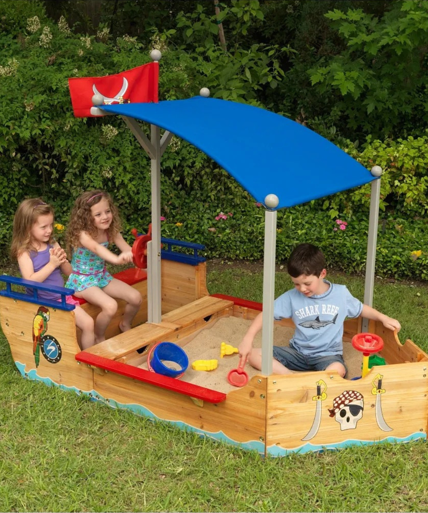 KidKraft Pirate Sand Boat Sandbox with Canopy and Storage, Wooden Outdoor Sand Play Boat for Kids Ages 5 and Up, Weather Resistant Wood, Large Play Area, Pirate Theme