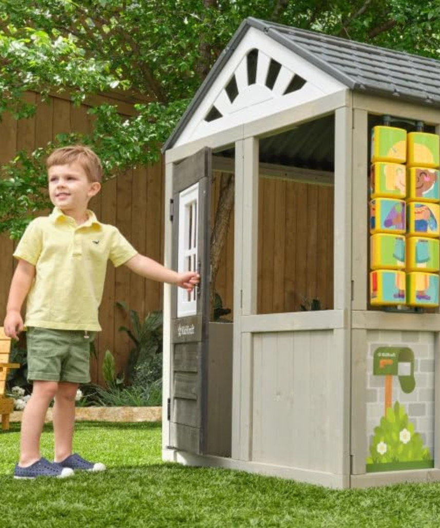 KidKraft Patio Party Wooden Outdoor Playhouse with Spinner Block Puzzle, 14pc, Backyard Playhouse for Kids Ages 3 and Up, Role Play Grill, Sink and Interactive Accessories