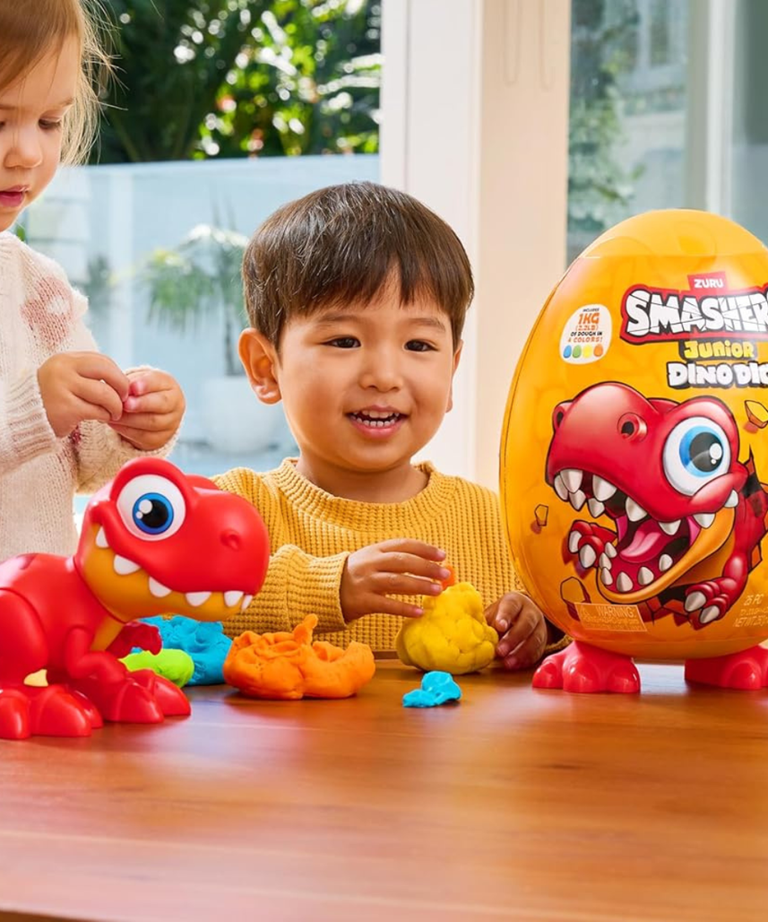 Smashers Junior Dino Dig Large Egg Brontosaur by ZURU, 18+ Surprises, Dinosaur Preschool Toy, Build + Construct Sensory Play for Kids 18 Months to 3 Years, Includes 1kg Clay + 6 Moulds + Stickers, Moveable Dino Figure