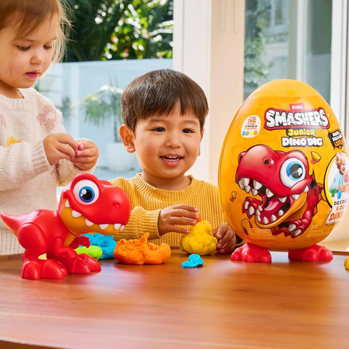 Smashers Junior Dino Dig Large Egg Brontosaur by ZURU, 18+ Surprises, Dinosaur Preschool Toy, Build + Construct Sensory Play for Kids 18 Months to 3 Years, Includes 1kg Clay + 6 Moulds + Stickers, Moveable Dino Figure