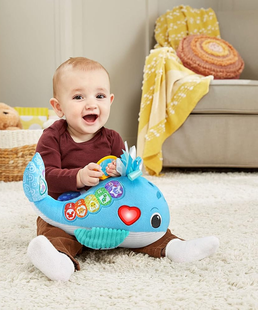 VTech Baby Snuggly Sounds Whale Interactive Sensory Toy with Lights Music and Textures for Infants 3 Months and Up