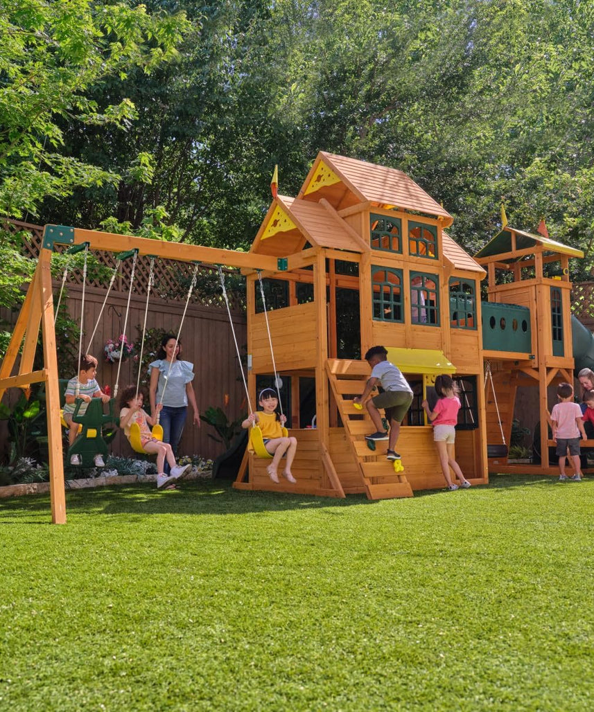 KidKraft Bear Cave Wooden Lodge Swing Set / Playset – Deluxe Outdoor Clubhouse with Slides, Swings, Glider, and Interactive Play Areas for Kids Age 3-10 Years