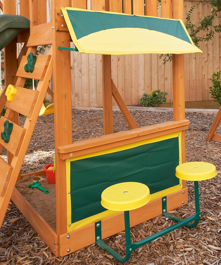 KidKraft Brightside Wooden Swing Set with High-Rail Wave Slide, Rock Wall, Upper Clubhouse, Monkey Bars, Sandbox and Belt Swings, Outdoor Backyard Playset for Kids Ages 3 to 10