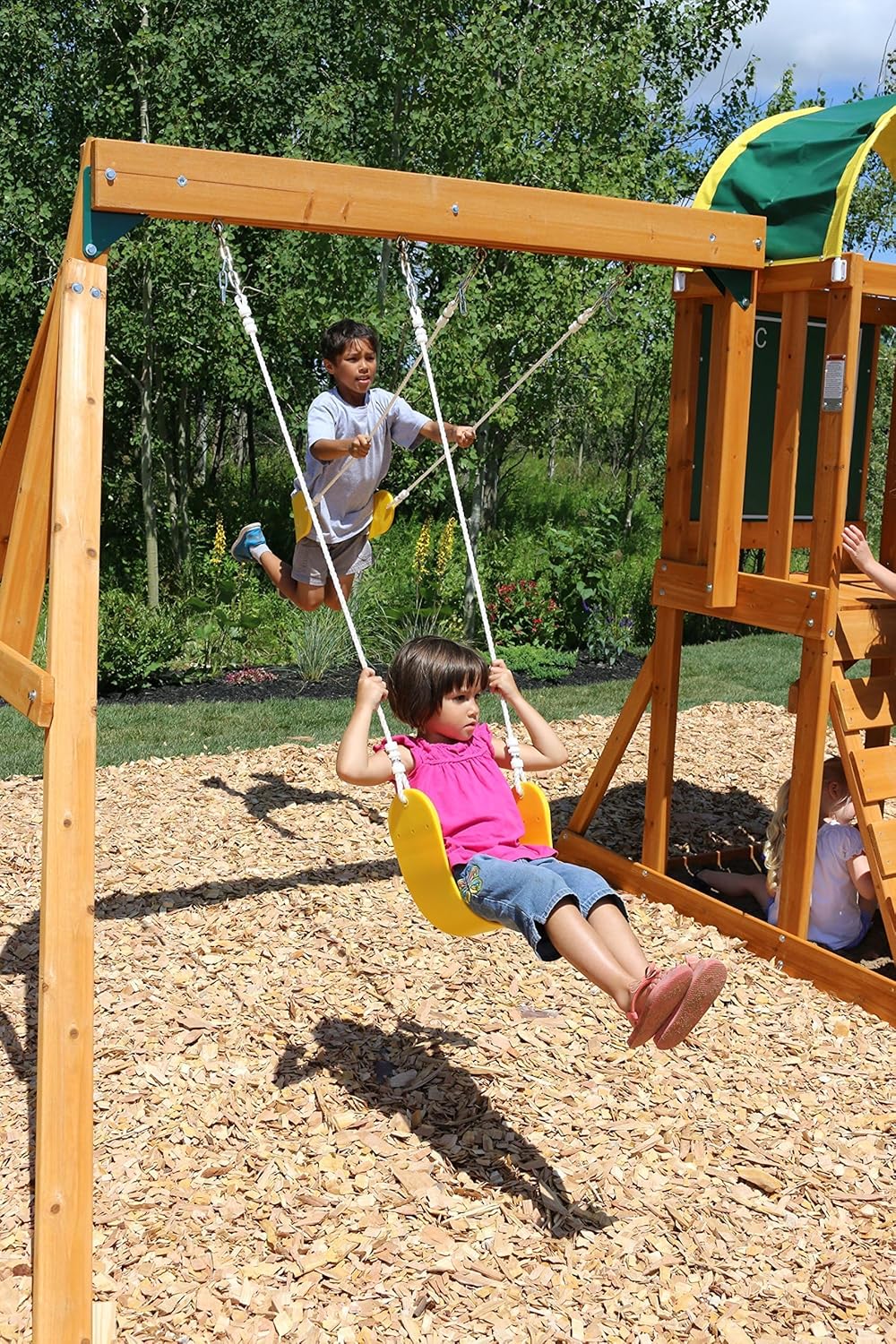 KidKraft Ainsley Outdoor Swing Set / Playset with High-Rail Wave Slide, Rock Wall, Upper-Level Clubhouse and Belt Swings, Multicolor Wooden Backyard Playset for Kids Ages 3 to 10