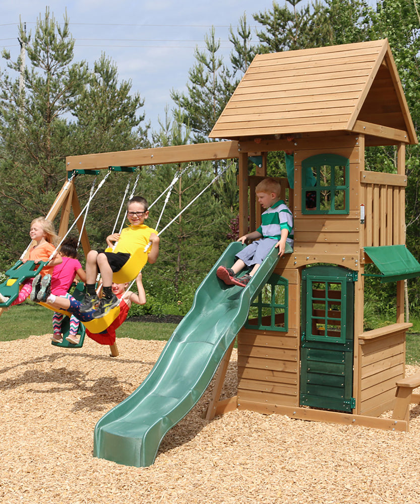 KidKraft Windale Fort Wooden Outdoor Swing Set, Playset with Clubhouse, Swings, High-Rail Wave Slide, Glider, Shaded Café Table and Bench, Multi-Level Backyard Play for Kids Ages 3 to 10