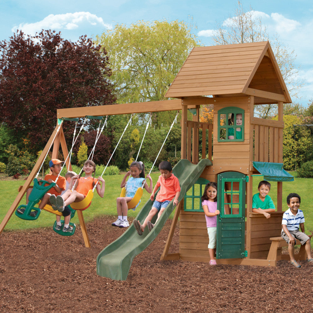KidKraft Windale Fort Wooden Outdoor Swing Set, Playset with Clubhouse, Swings, High-Rail Wave Slide, Glider, Shaded Café Table and Bench, Multi-Level Backyard Play for Kids Ages 3 to 10
