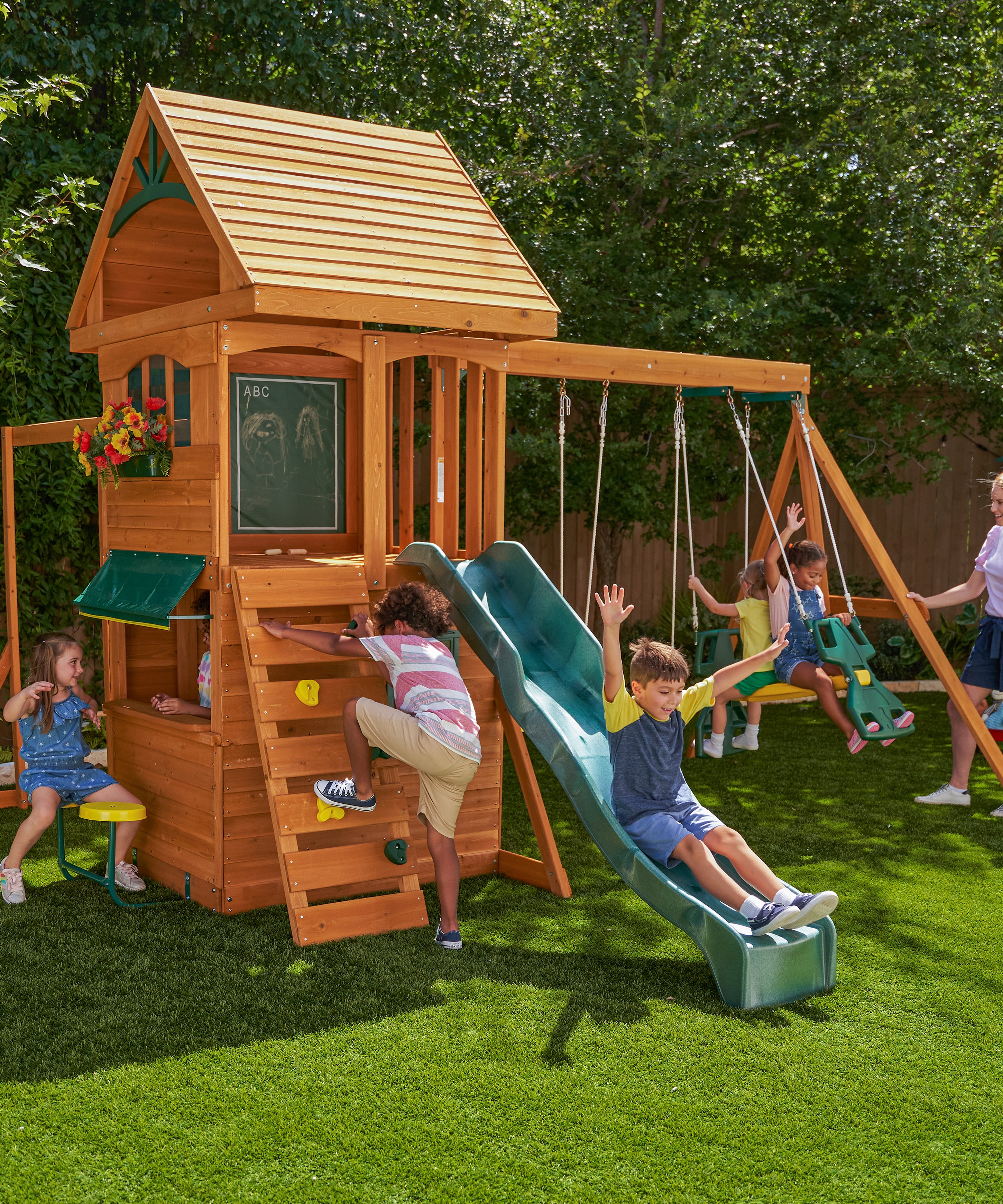 KidKraft Ridgeview Deluxe Clubhouse Wooden Swing Set/Playset with High-Rail Wave Slide, Rock Wall, Monkey Bars, Glider and Café Area, Outdoor Backyard Playset for Kids Ages 3 to 10