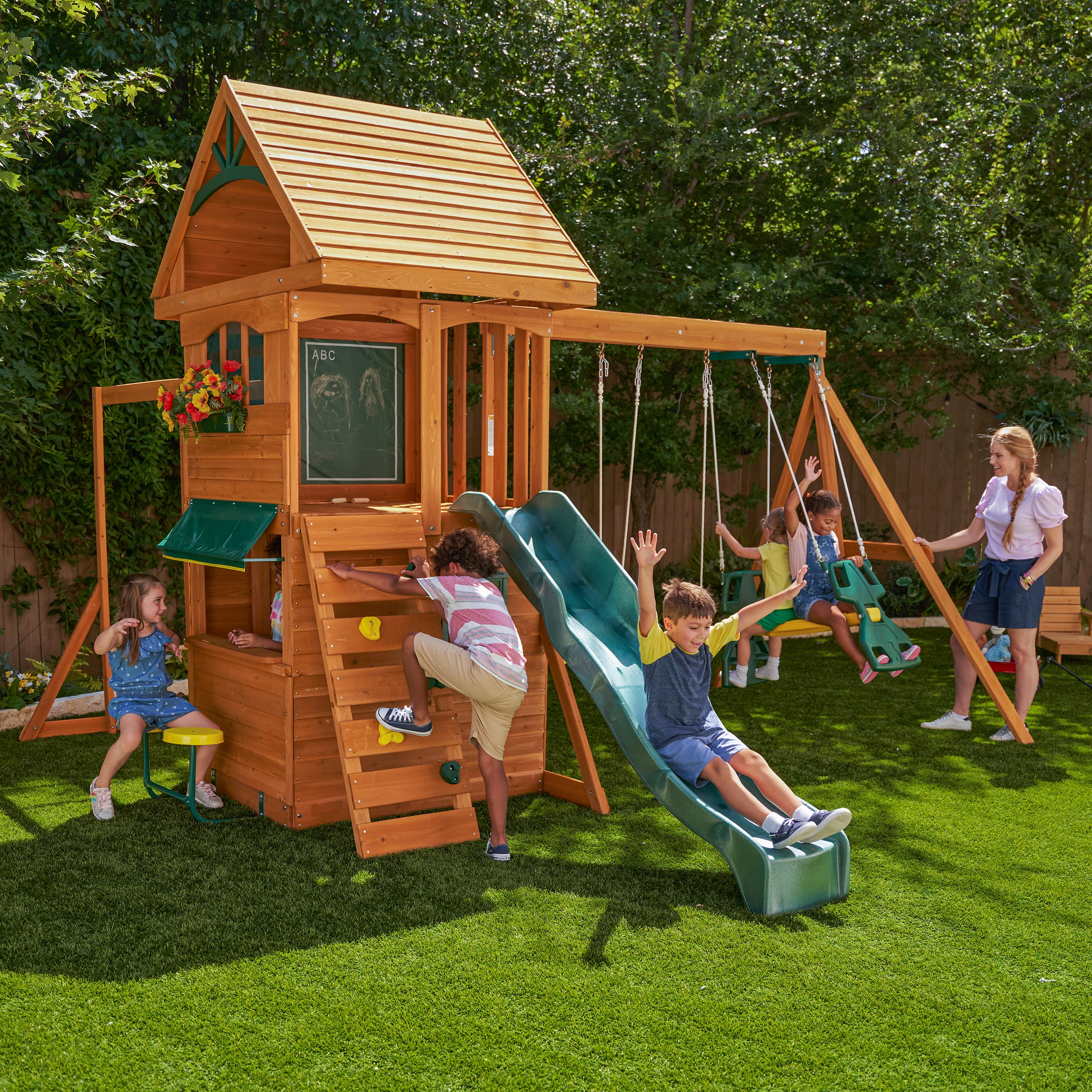 KidKraft Ridgeview Deluxe Clubhouse Wooden Swing Set/Playset with High-Rail Wave Slide, Rock Wall, Monkey Bars, Glider and Café Area, Outdoor Backyard Playset for Kids Ages 3 to 10